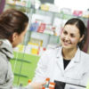pharmacist suggesting medical drug to buyer in pharmacy drugstore