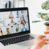 Young Asia businesswoman using laptop talk to colleague about plan in video call meeting while work from home at living room. Self-isolation, social distancing, quarantine for corona virus prevention.